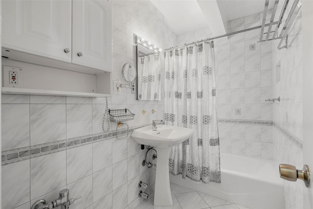 620 W 239th St Unit 2C, Bronx, NY 10463 - bathroom with tile walls, shower / tub combo, and tile patterned floors