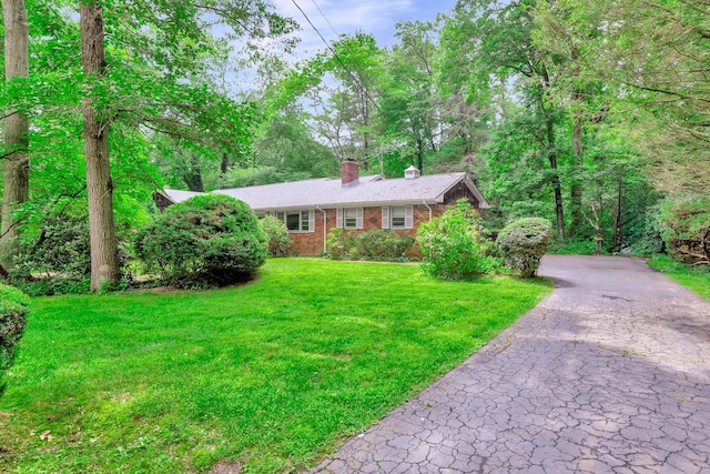 15 Carol Ct, Dix Hills, NY 11746 - single story home with a chimney, brick siding, and a front lawn
