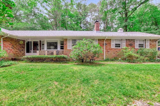 15 Carol Ct, Dix Hills, NY 11746 - single story home with a chimney, a front yard, and brick siding