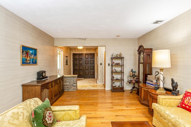 15 Carol Ct, Dix Hills, NY 11746 - living area with wallpapered walls and light wood-style floors