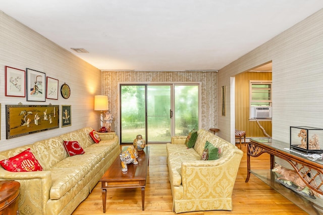 15 Carol Ct, Dix Hills, NY 11746 - living room featuring wallpapered walls, cooling unit, and wood finished floors