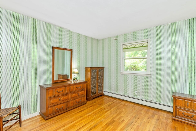 15 Carol Ct, Dix Hills, NY 11746 - bedroom with baseboard heating, wallpapered walls, and light wood finished floors