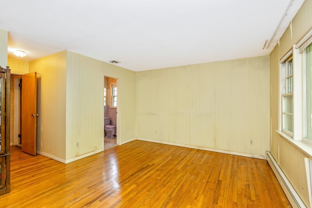 15 Carol Ct, Dix Hills, NY 11746 - spare room featuring baseboard heating and wood finished floors
