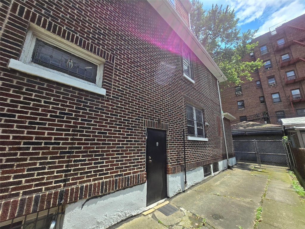 40-44 Hampton St, Elmhurst, NY 11373 - view of side of property featuring brick siding