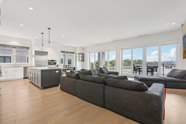 720 Davenport Ave Unit 3, New Rochelle, NY 10805 - living area featuring light wood-style flooring, plenty of natural light, and recessed lighting