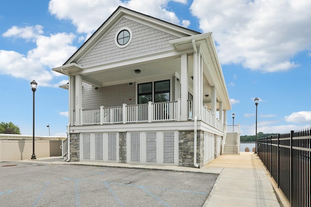 720 Davenport Ave Unit 3, New Rochelle, NY 10805 - view of front of property featuring stone siding, stairs, and a porch