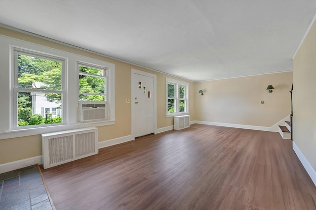 23 Jackson Ave, White Plains, NY 10606 - unfurnished living room featuring radiator, wood finished floors, and cooling unit