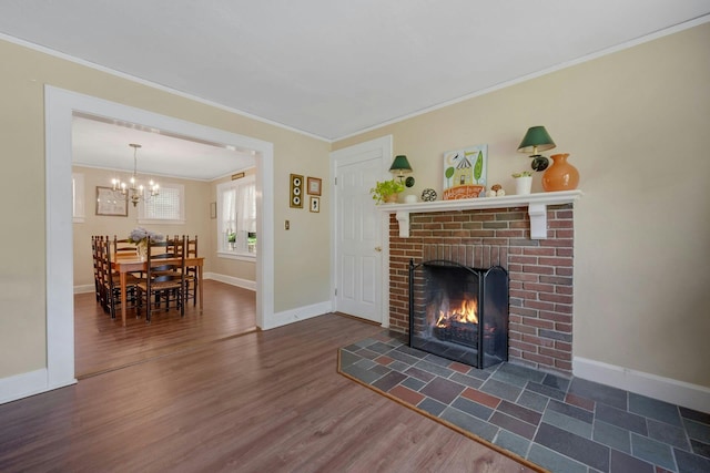 23 Jackson Ave, White Plains, NY 10606 - living room featuring ornamental molding, dark wood-style flooring, a fireplace, and a chandelier