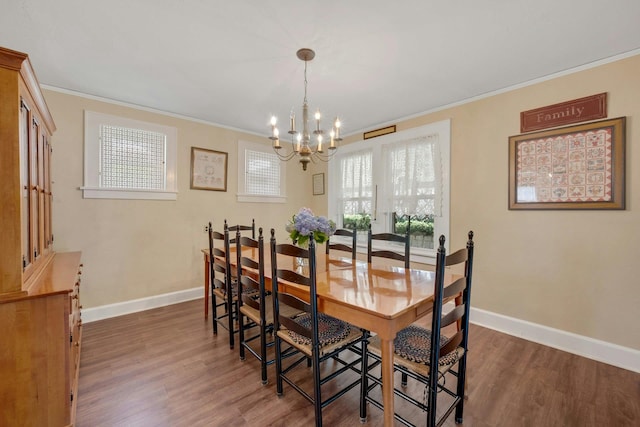 23 Jackson Ave, White Plains, NY 10606 - dining room with a chandelier, dark wood finished floors, and crown molding