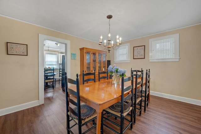 23 Jackson Ave, White Plains, NY 10606 - dining room with a chandelier, crown molding, and wood finished floors
