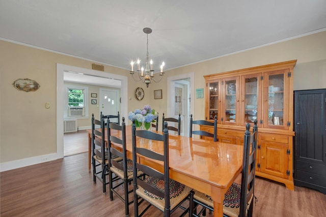 23 Jackson Ave, White Plains, NY 10606 - dining area featuring a chandelier, light wood-style floors, and ornamental molding