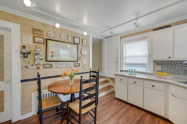 23 Jackson Ave, White Plains, NY 10606 - dining room with wallpapered walls, light wood-style floors, track lighting, and crown molding
