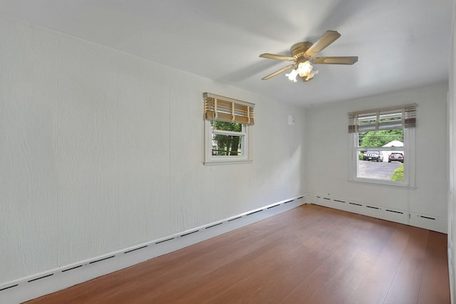 23 Jackson Ave, White Plains, NY 10606 - unfurnished room featuring wood finished floors, ceiling fan, and a baseboard radiator