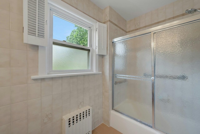 23 Jackson Ave, White Plains, NY 10606 - full bathroom featuring radiator heating unit, healthy amount of natural light, and enclosed tub / shower combo