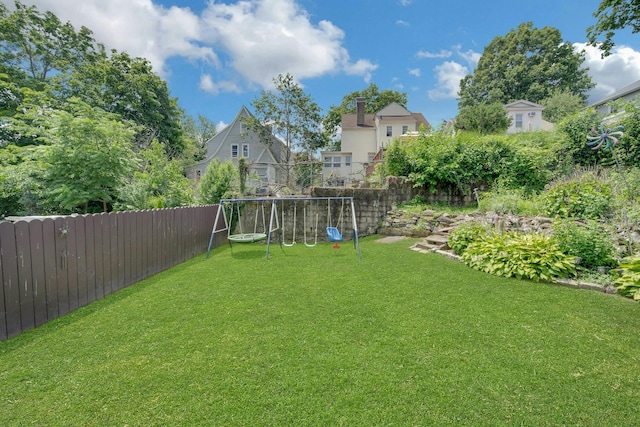 23 Jackson Ave, White Plains, NY 10606 - fenced backyard featuring a playground