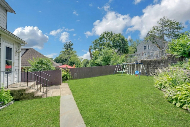 23 Jackson Ave, White Plains, NY 10606 - fenced backyard featuring a playground