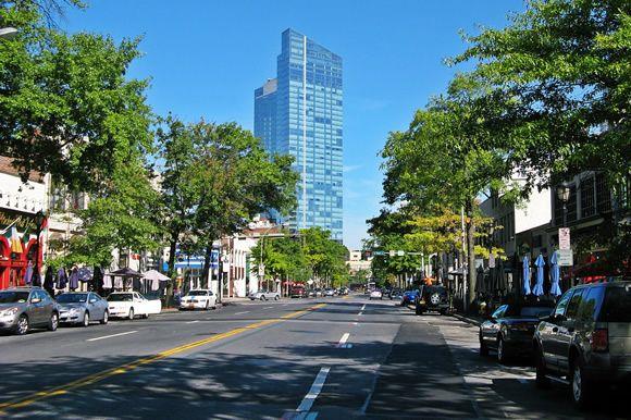 23 Jackson Ave, White Plains, NY 10606 - view of asphalt street featuring a city view, sidewalks, street lights, and curbs