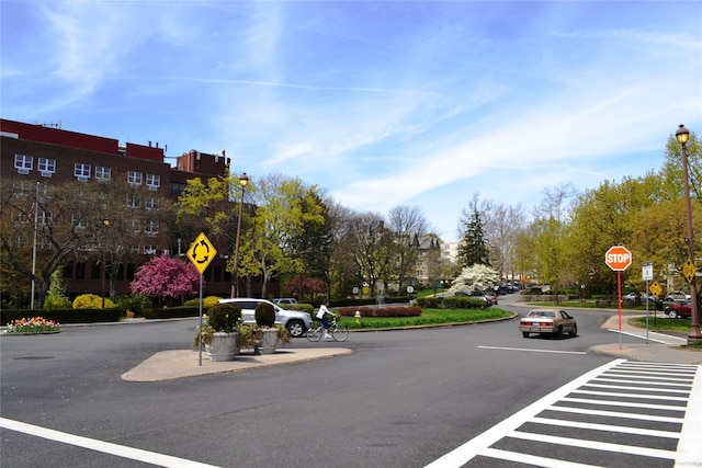 1133 Midland Ave Unit 1K, Yonkers, NY 10708 - view of asphalt street featuring traffic signs, curbs, and street lights