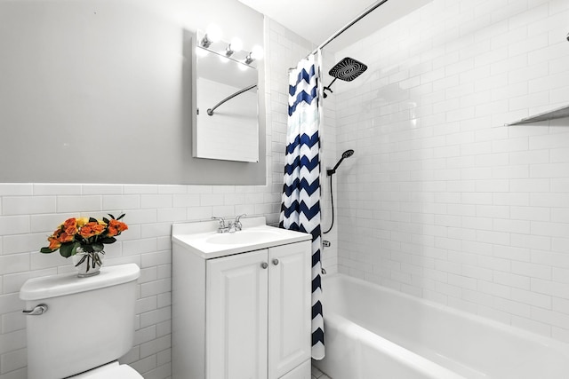 370 Central Park Ave Unit 3D, Scarsdale, NY 10583 - full bath with tile walls, vanity, shower / bathtub combination with curtain, and a wainscoted wall