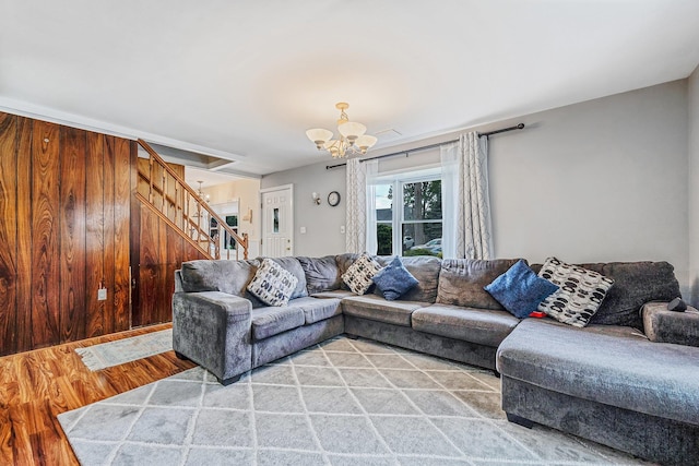 19 Buttercup Ln, Levittown, NY 11756 - living area featuring stairway, wood finished floors, and a chandelier