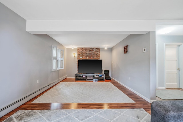 19 Buttercup Ln, Levittown, NY 11756 - living room with a baseboard heating unit and wood finished floors