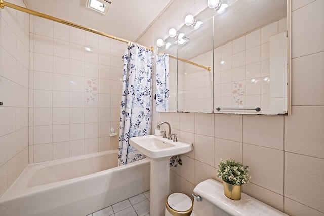 19 Buttercup Ln, Levittown, NY 11756 - bathroom with tile walls, shower / bath combo with shower curtain, and tile patterned floors