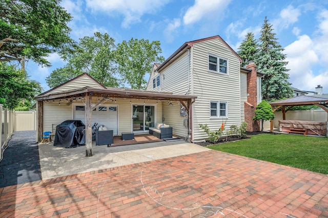 19 Buttercup Ln, Levittown, NY 11756 - rear view of house with a hot tub, a gazebo, a patio, outdoor lounge area, and a fenced backyard