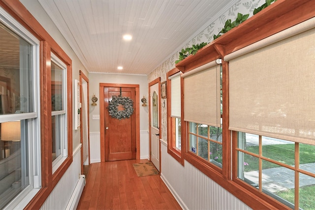 15 5th Ave, Kings Park, NY 11754 - doorway to outside with hardwood / wood-style floors, wainscoting, a baseboard heating unit, and recessed lighting