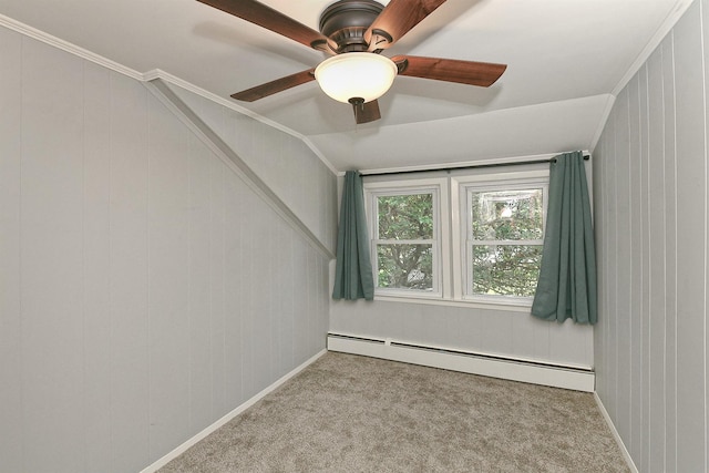 15 5th Ave, Kings Park, NY 11754 - carpeted spare room featuring a baseboard radiator, ornamental molding, vaulted ceiling, and a ceiling fan
