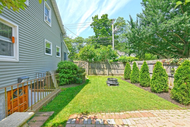 15 5th Ave, Kings Park, NY 11754 - fenced backyard with an outdoor fire pit