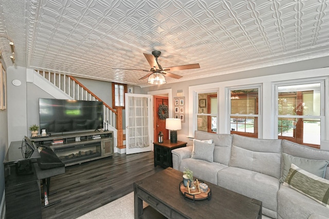 15 5th Ave, Kings Park, NY 11754 - living area with stairway, wood finished floors, an ornate ceiling, and ceiling fan
