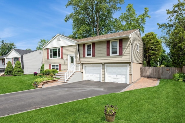 9 Phyllis Ct, Kings Park, NY 11754 - split foyer home with an attached garage and driveway