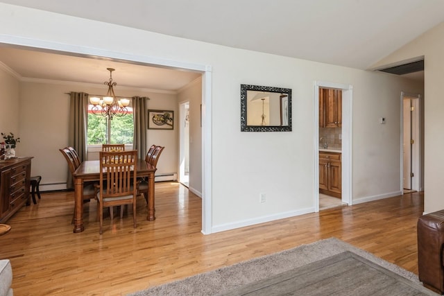 9 Phyllis Ct, Kings Park, NY 11754 - dining area with light wood-type flooring, a chandelier, ornamental molding, a baseboard radiator, and a baseboard heating unit