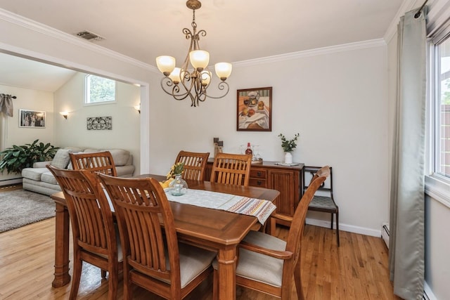 9 Phyllis Ct, Kings Park, NY 11754 - dining area featuring light wood-style floors, ornamental molding, a chandelier, and baseboard heating