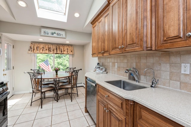 9 Phyllis Ct, Kings Park, NY 11754 - kitchen featuring dishwasher, brown cabinets, light countertops, decorative backsplash, and recessed lighting