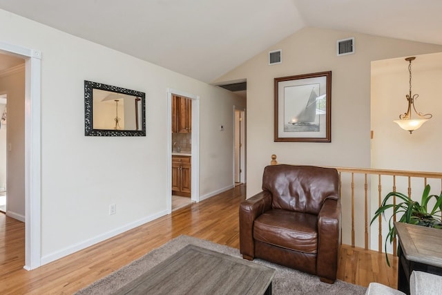 9 Phyllis Ct, Kings Park, NY 11754 - sitting room with light wood finished floors and vaulted ceiling
