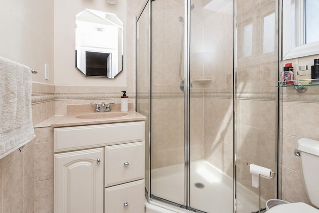 9 Phyllis Ct, Kings Park, NY 11754 - full bath with a stall shower, tile walls, and vanity