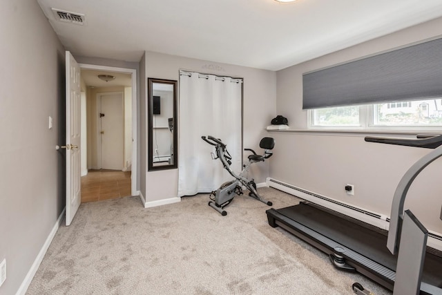 9 Phyllis Ct, Kings Park, NY 11754 - exercise room with a baseboard heating unit and carpet floors