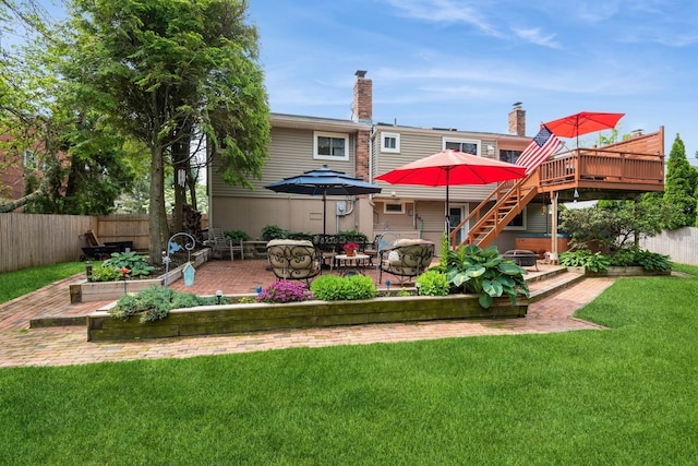 9 Phyllis Ct, Kings Park, NY 11754 - rear view of property featuring a patio area, a wooden deck, stairs, and a chimney