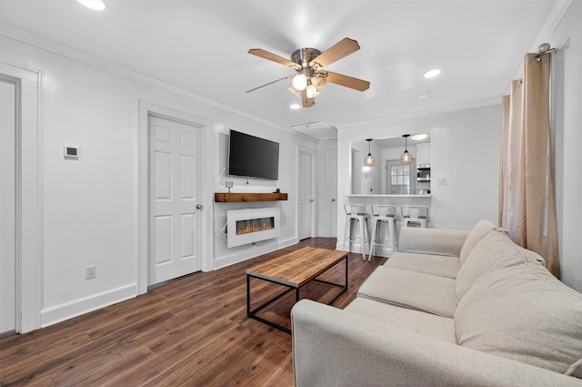 12 Lake Region Blvd, Monroe, NY 10950 - living area featuring dark wood-type flooring, a glass covered fireplace, ceiling fan, crown molding, and recessed lighting
