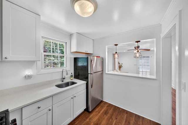 12 Lake Region Blvd, Monroe, NY 10950 - kitchen featuring freestanding refrigerator, white cabinets, dark wood-style floors, crown molding, and ceiling fan
