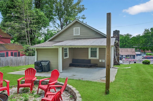 12 Lake Region Blvd, Monroe, NY 10950 - back of house with a patio area and a chimney