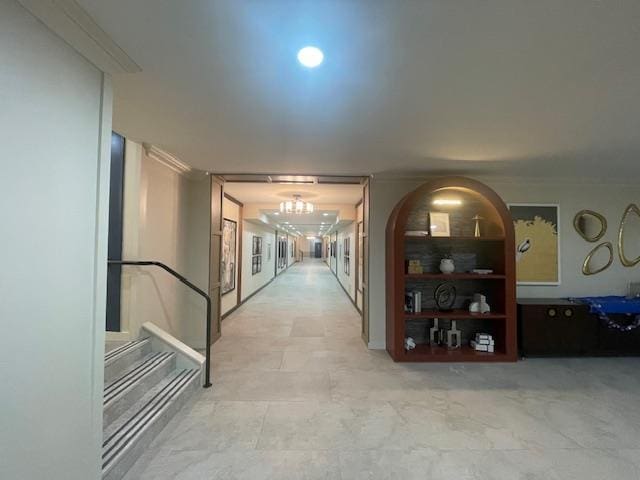360 Central Ave Unit 218-219, Lawrence, NY 11559 - hall with a chandelier and ornamental molding