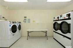 360 Central Ave Unit 218-219, Lawrence, NY 11559 - shared laundry featuring washing machine and clothes dryer
