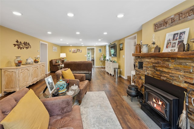 123 Pleasant Rd, Lake Peekskill, NY 10537 - living room with dark wood-type flooring, recessed lighting, and a wood stove