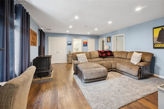 123 Pleasant Rd, Lake Peekskill, NY 10537 - living room with wood finished floors, a wood stove, and recessed lighting
