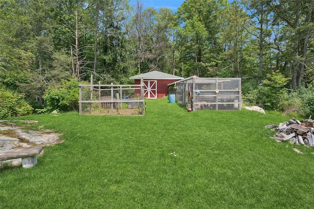 123 Pleasant Rd, Lake Peekskill, NY 10537 - view of grassy yard featuring exterior structure and an outbuilding