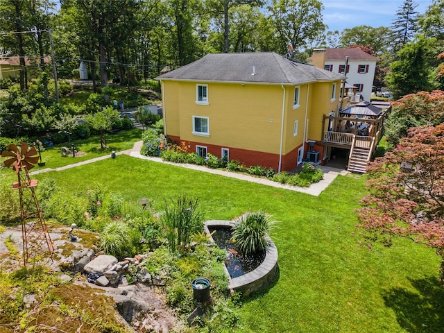123 Pleasant Rd, Lake Peekskill, NY 10537 - rear view of property featuring a gazebo, stairway, a yard, a deck, and stucco siding