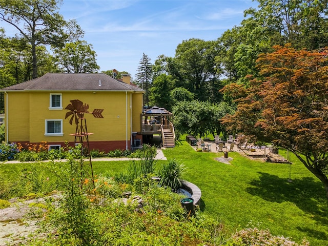 123 Pleasant Rd, Lake Peekskill, NY 10537 - view of side of home with a gazebo, a chimney, and a yard