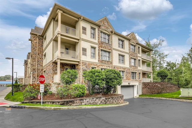 24 N De Baun Ave Unit 304, Suffern, NY 10901 - view of property featuring a garage and driveway